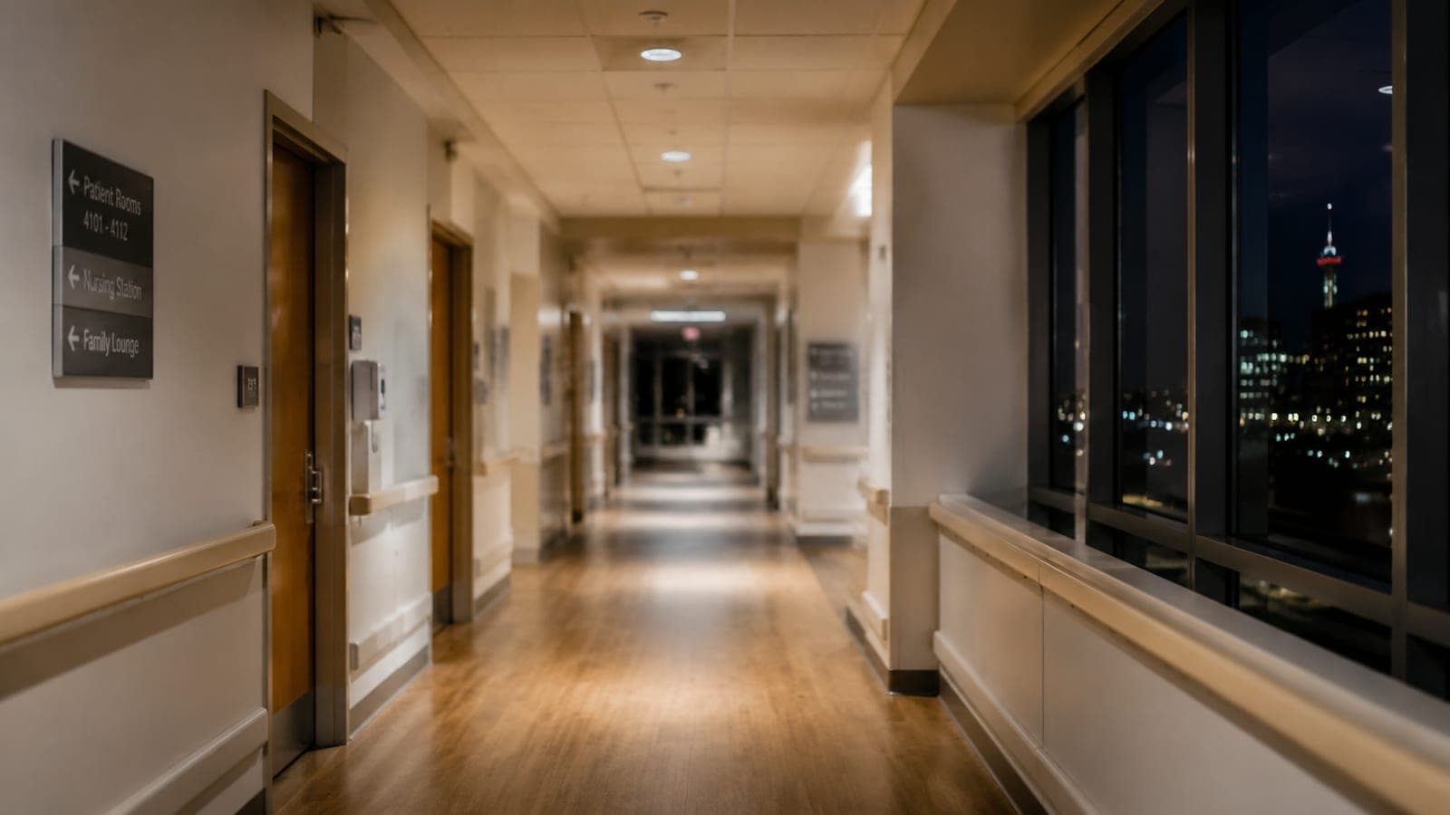 Empty hospital corridor at night with soft lighting, Ottawa bedside notary visit context