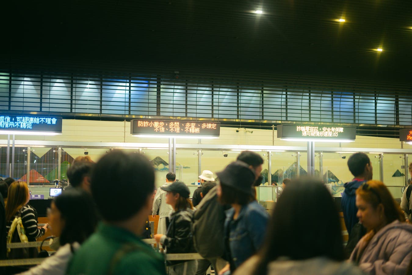 Air Canada check-in counters at Ottawa Macdonald-Cartier International Airport in early morning, with a parent showing a notarized travel consent letter to the agent