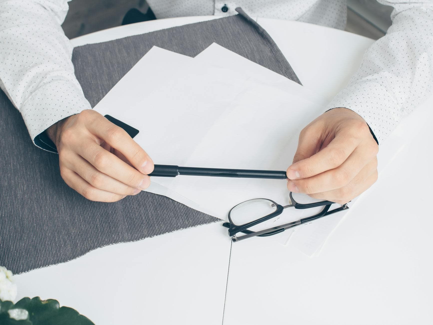 HR representative reviewing a draft employment letter on company letterhead before signing in front of a notary