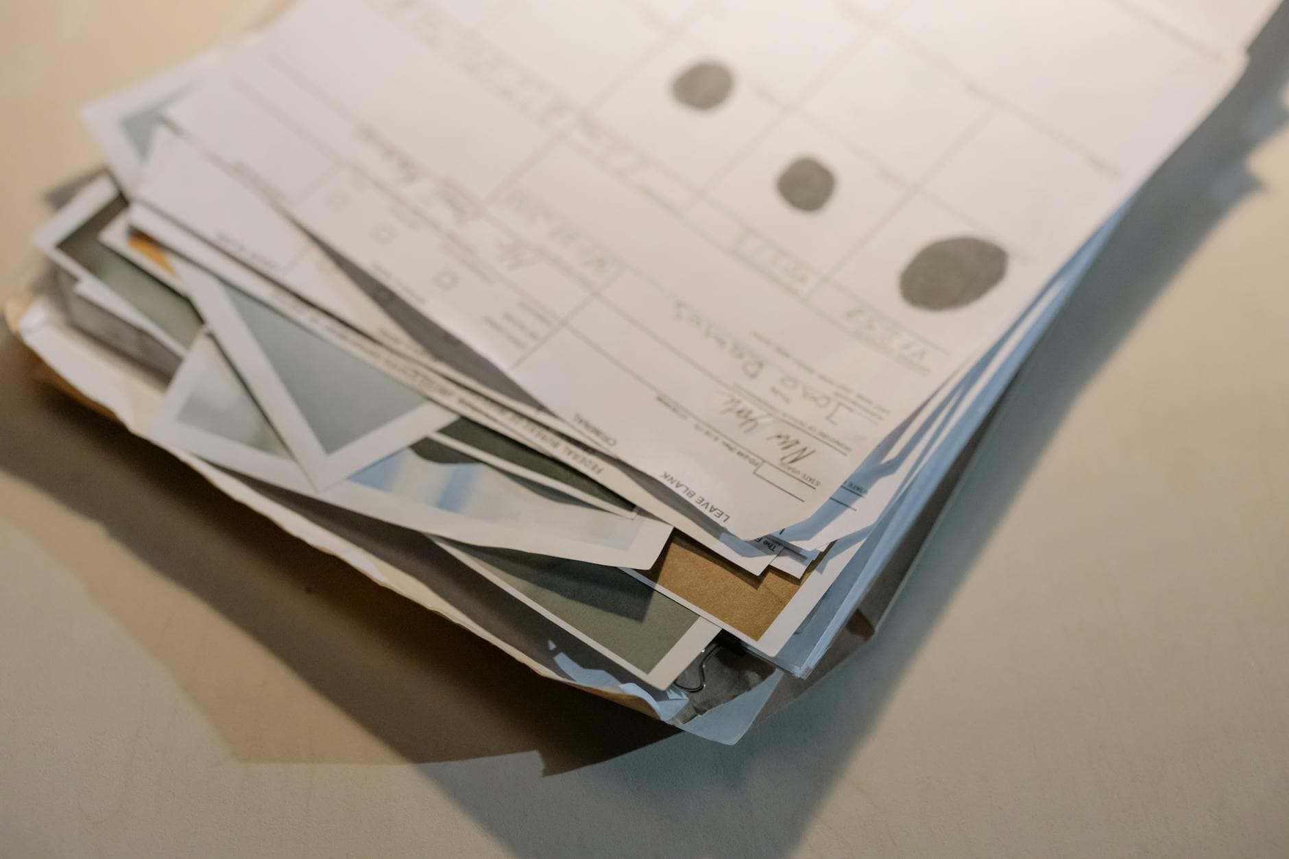 Three different employment letters on different letterheads stacked on an Ottawa notary's desk, illustrating the variety of receiver requirements
