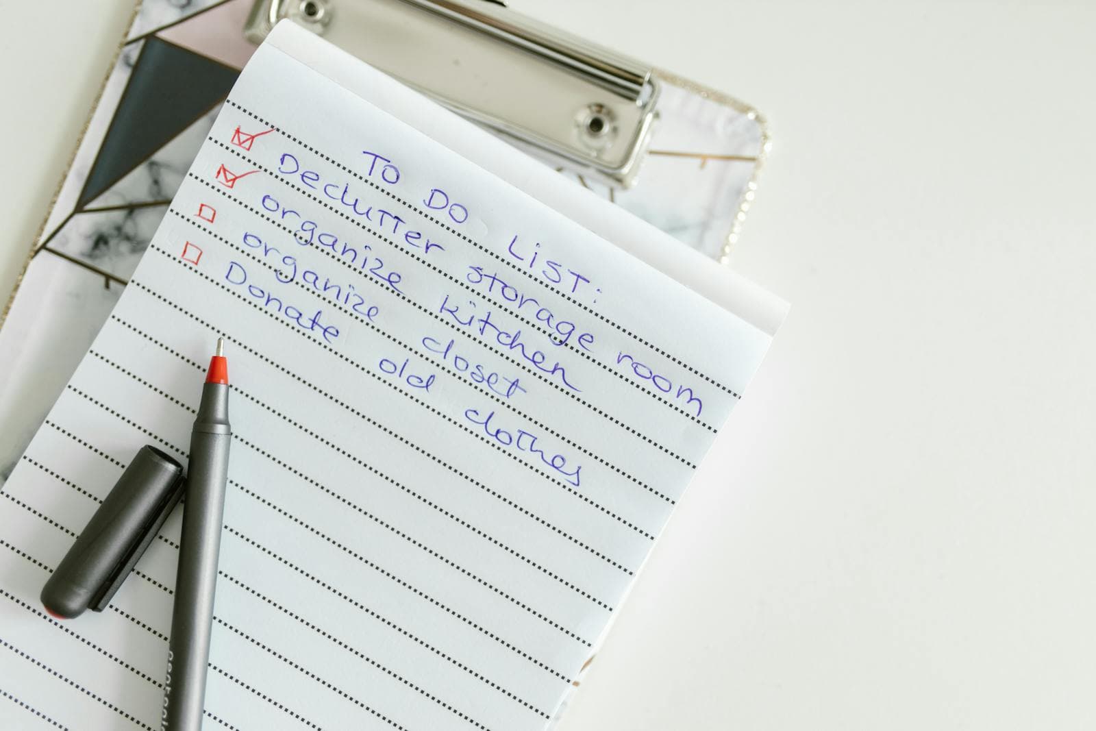 Inline 3: a printed IRCC checklist beside a stack of original documents and certified copies, with a pen ready for signature