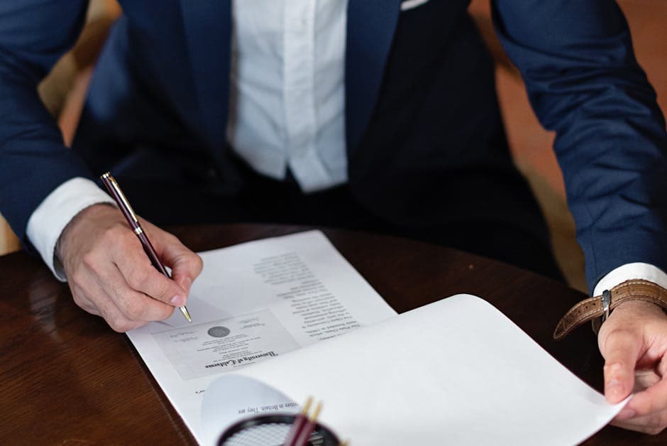 Ottawa client signing an affidavit at a notary's desk while the notary applies the seal, illustrating notary public vs justice of the peace Ontario in practice