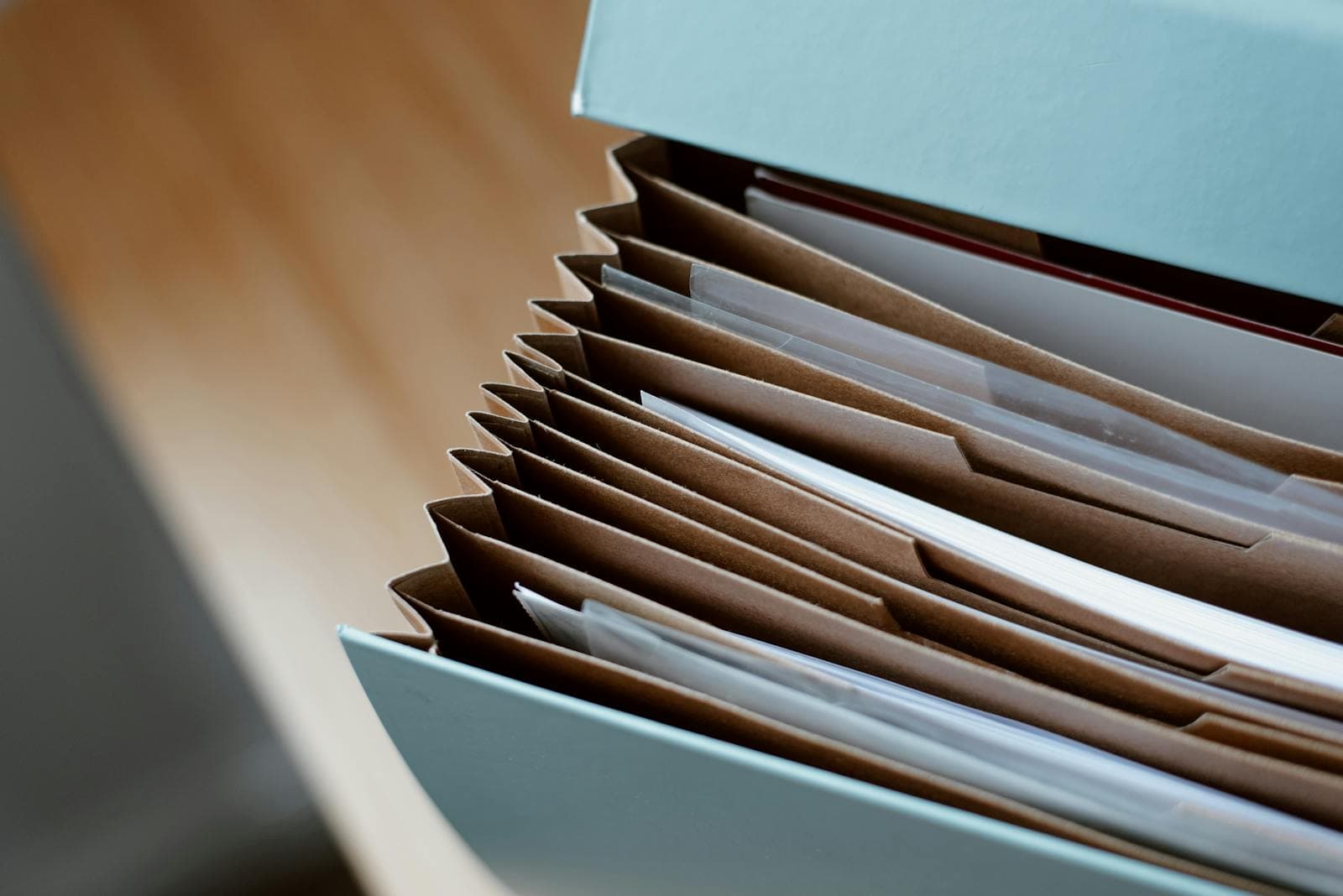 A grantor's folder containing a drafted property POA, a drafted personal-care POA, government photo ID, and a doctor's capacity letter, ready for an Ottawa notary appointment
